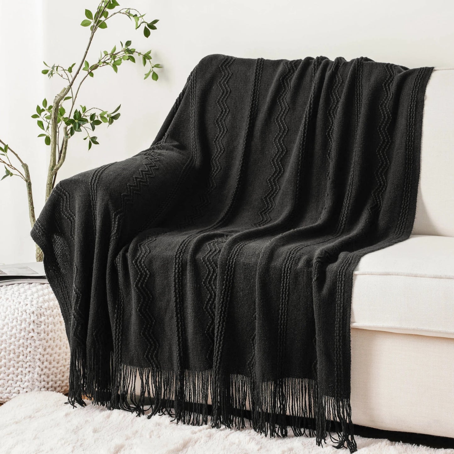 plaid-chauffant-caroussel-canape-noir