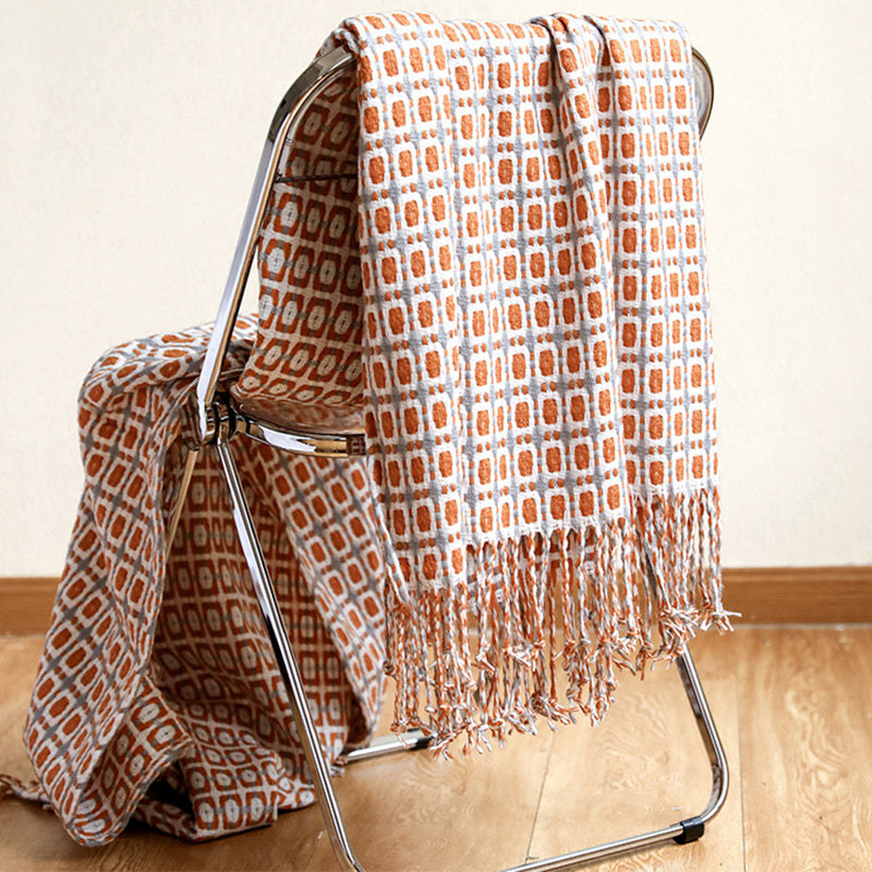 plaid-chauffant-horizons-caroussel-marron-sur-fauteuil