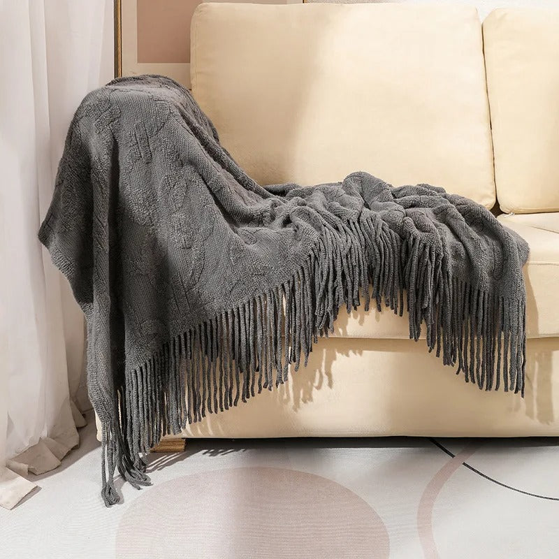 plaid-chauffant-caroussel-noir-canape