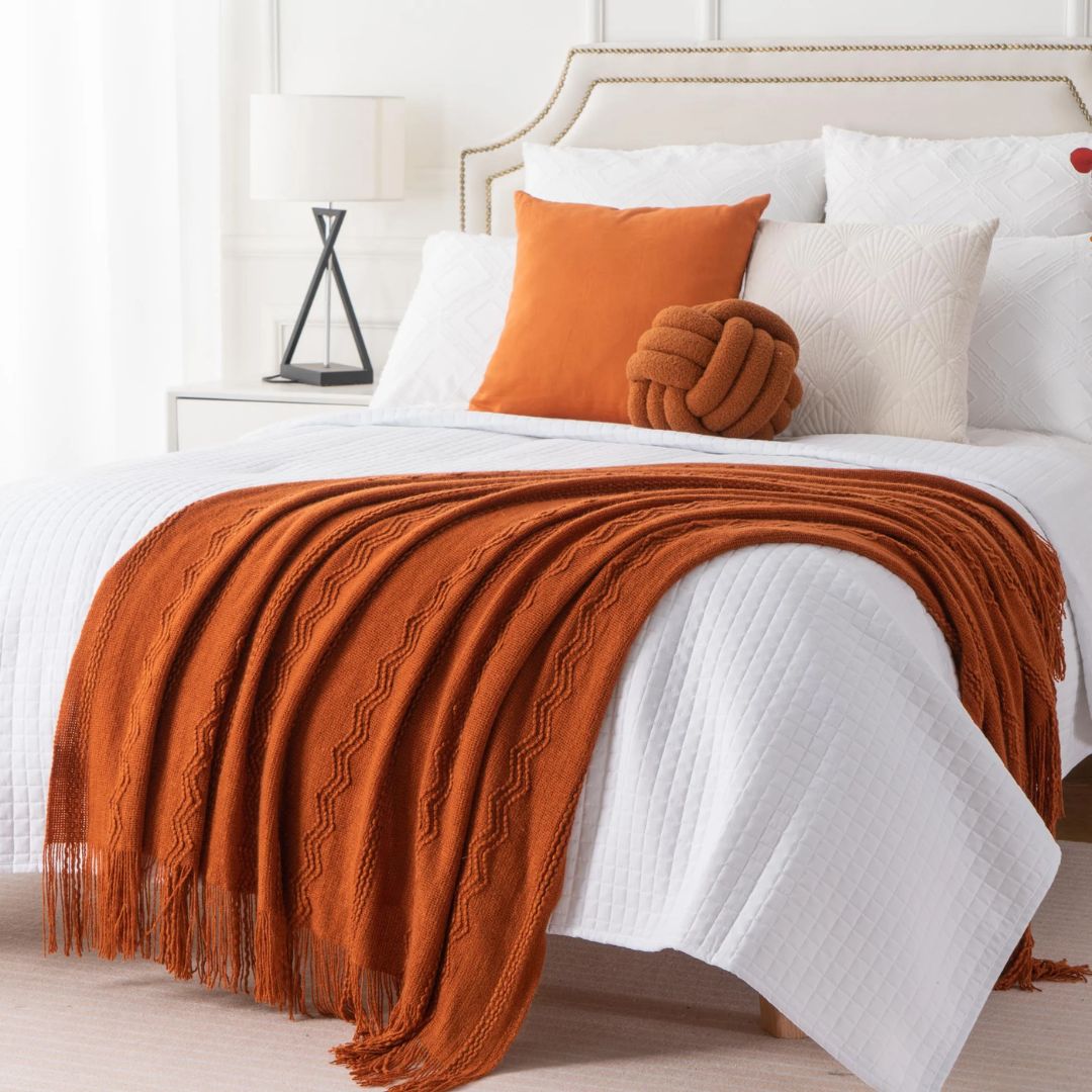 plaid-chauffant-jetee-lit-hotel-orange