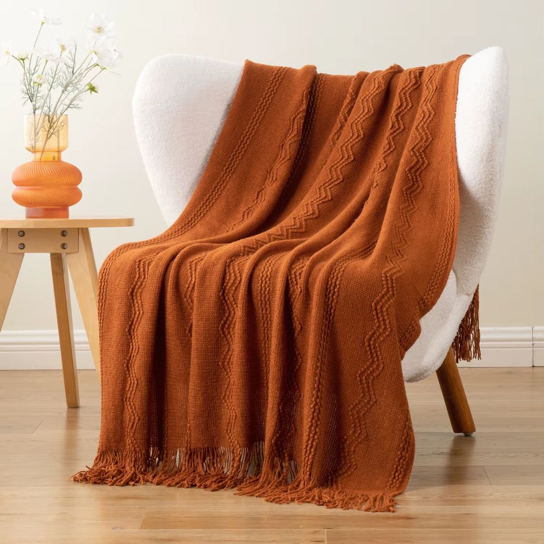 plaid-chauffant-orange-chaise